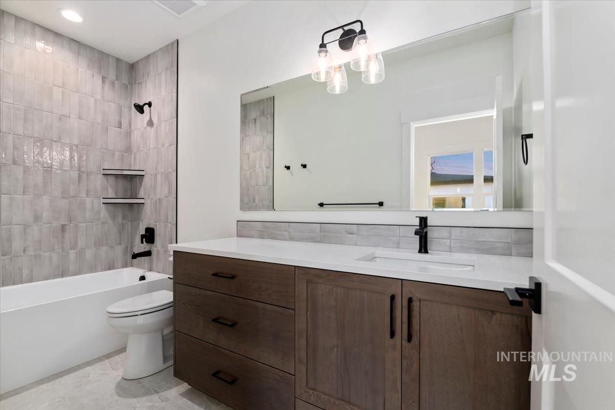 Full bath with vanity and  shower combination