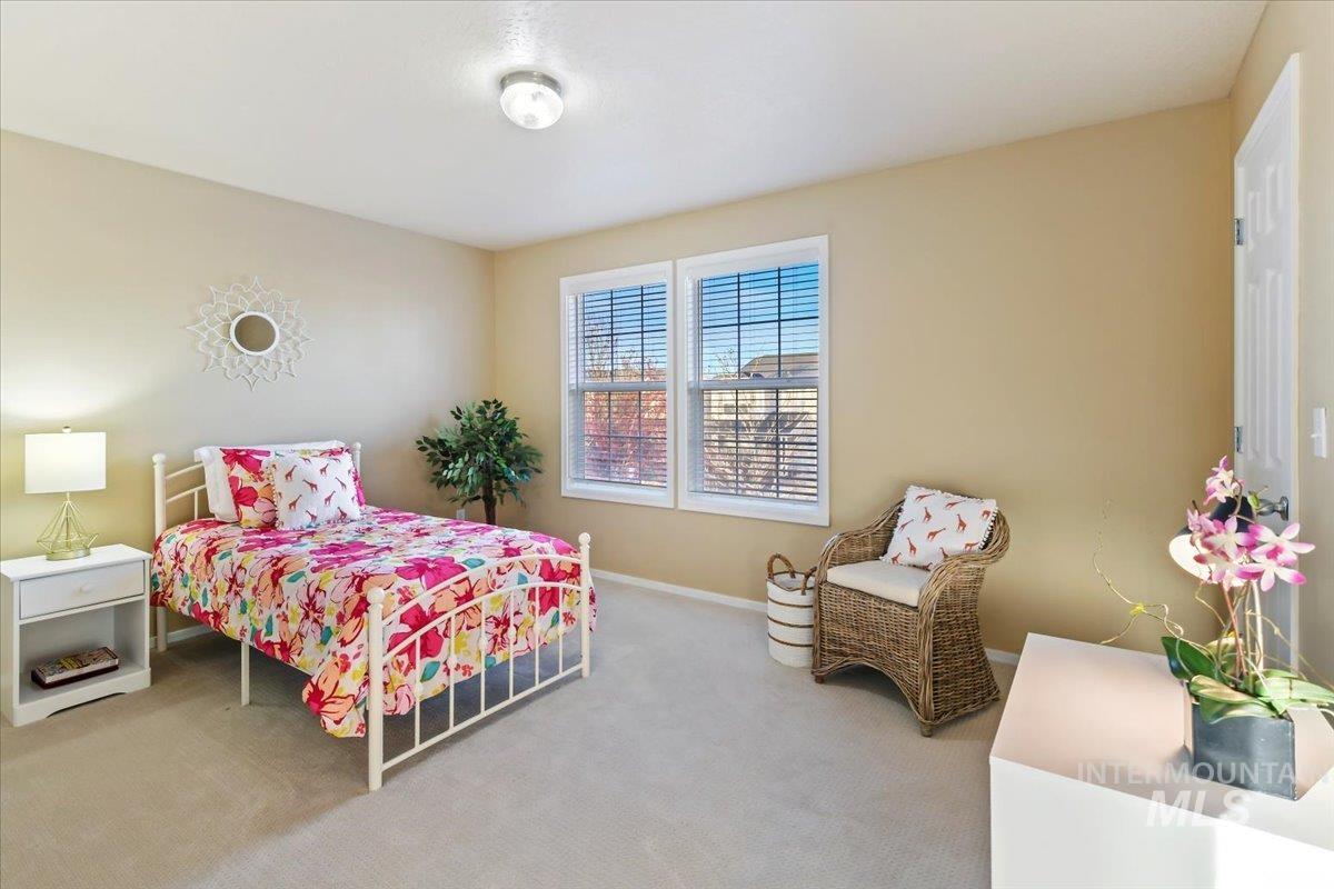 Carpeted bedroom with baseboards