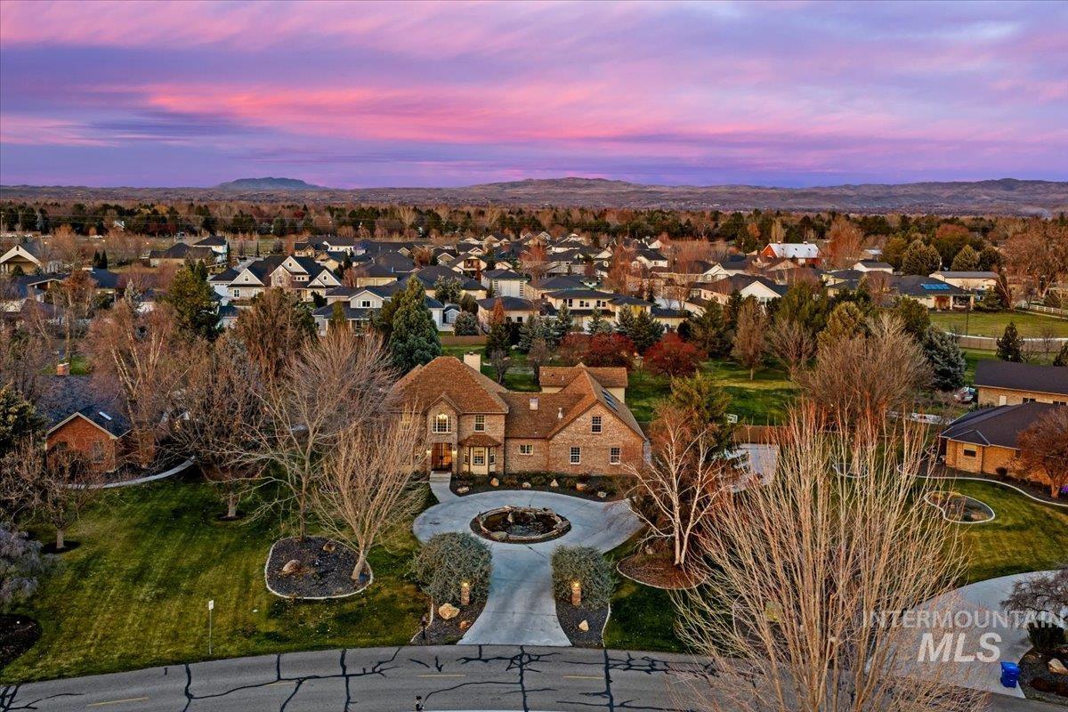 Aerial view at dusk of a residential view and a mountain view