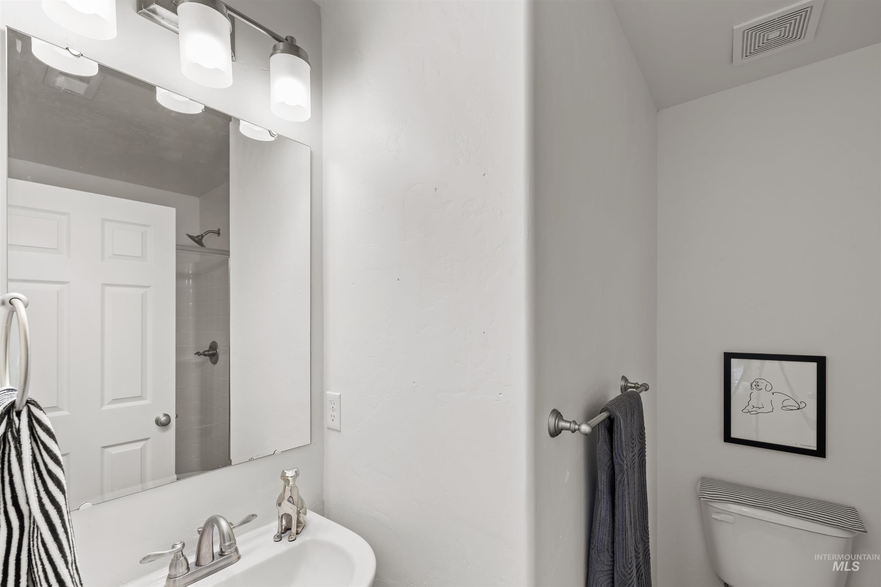 Full bathroom with a shower and toilet