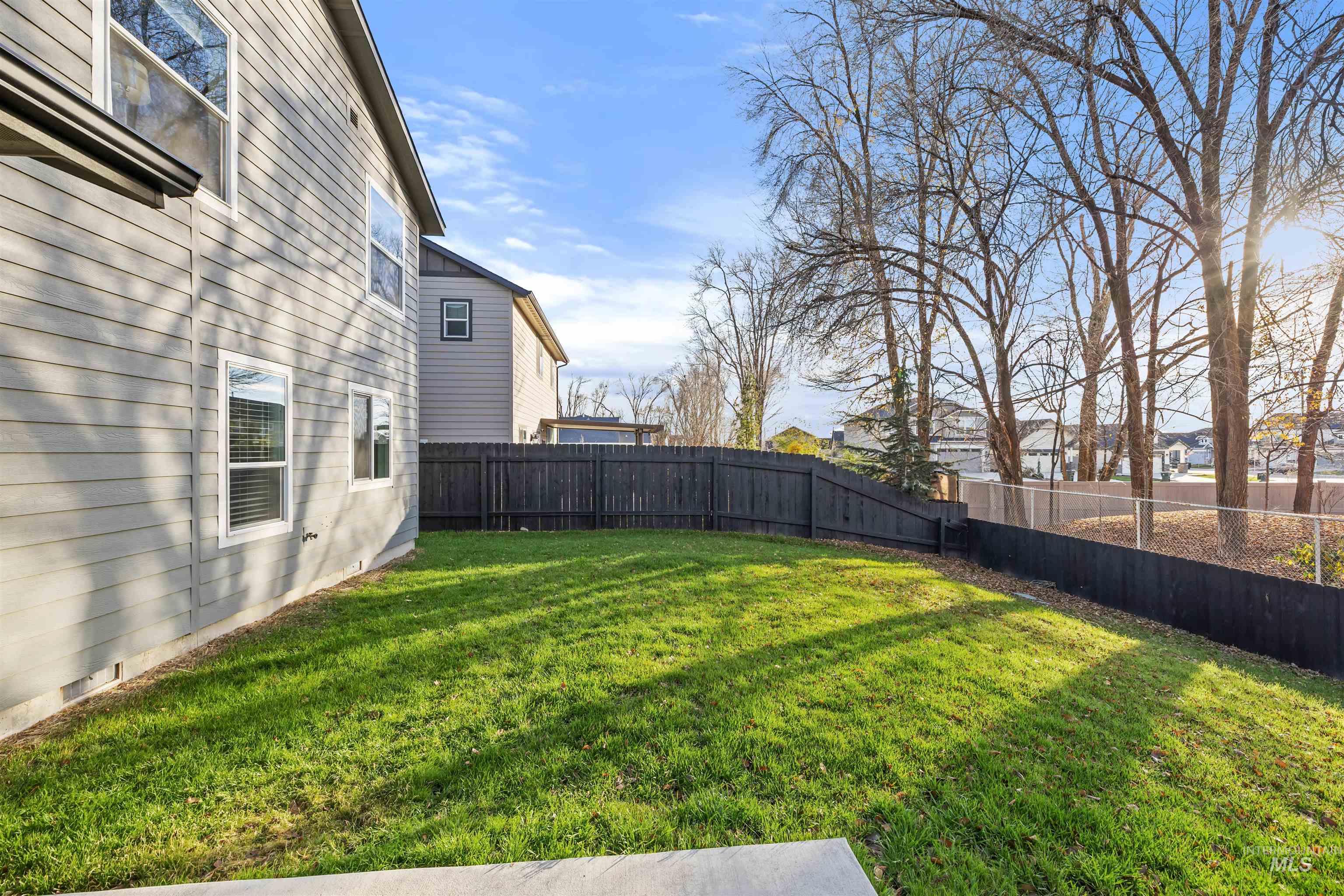 View of fenced backyard