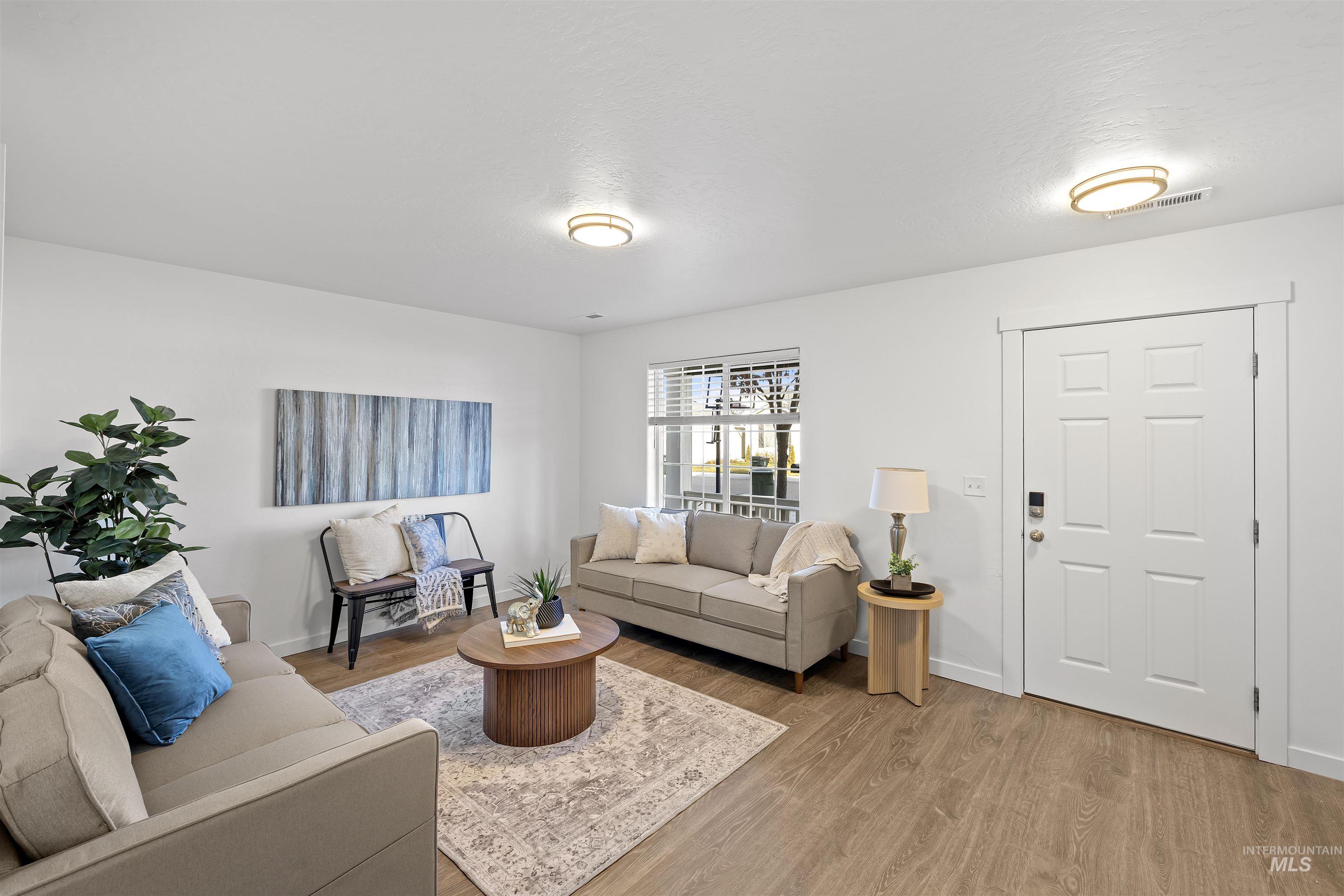 Living room featuring wood finished floors and baseboards