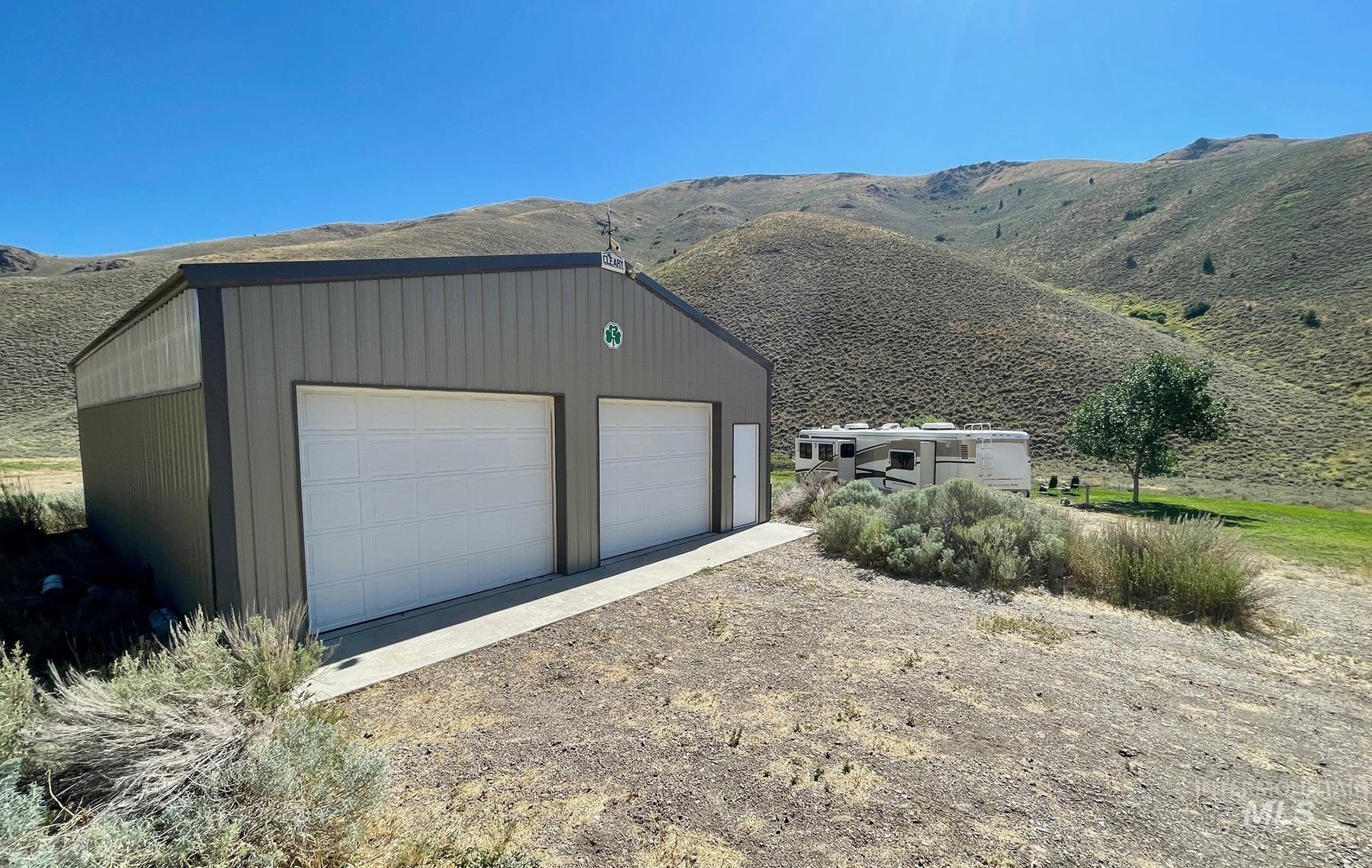 Detached garage with a mountain view