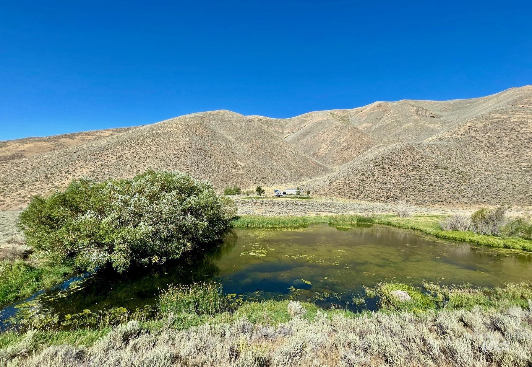 View of mountain backdrop with a nearby body of water