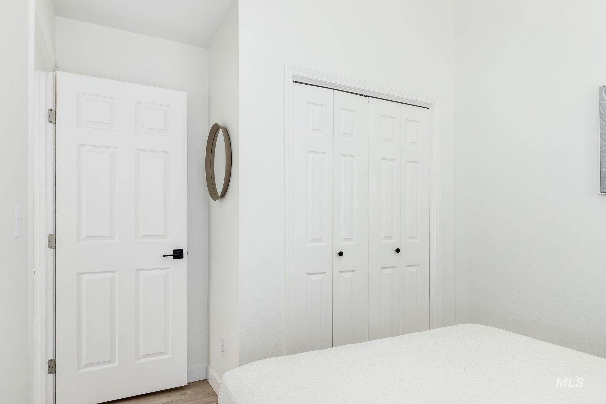 Bedroom featuring a closet and wood finished floors