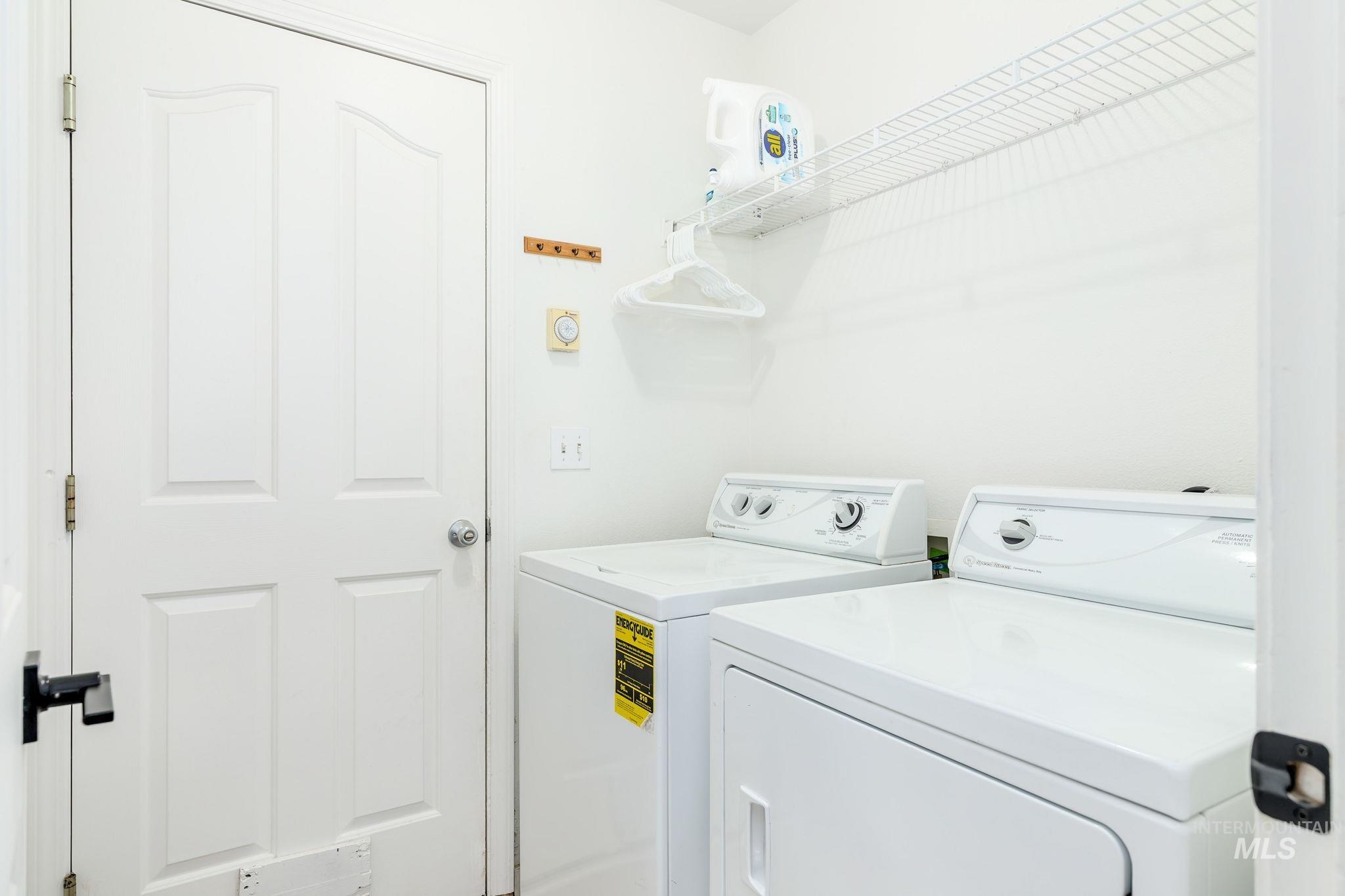 Washroom featuring independent washer and dryer