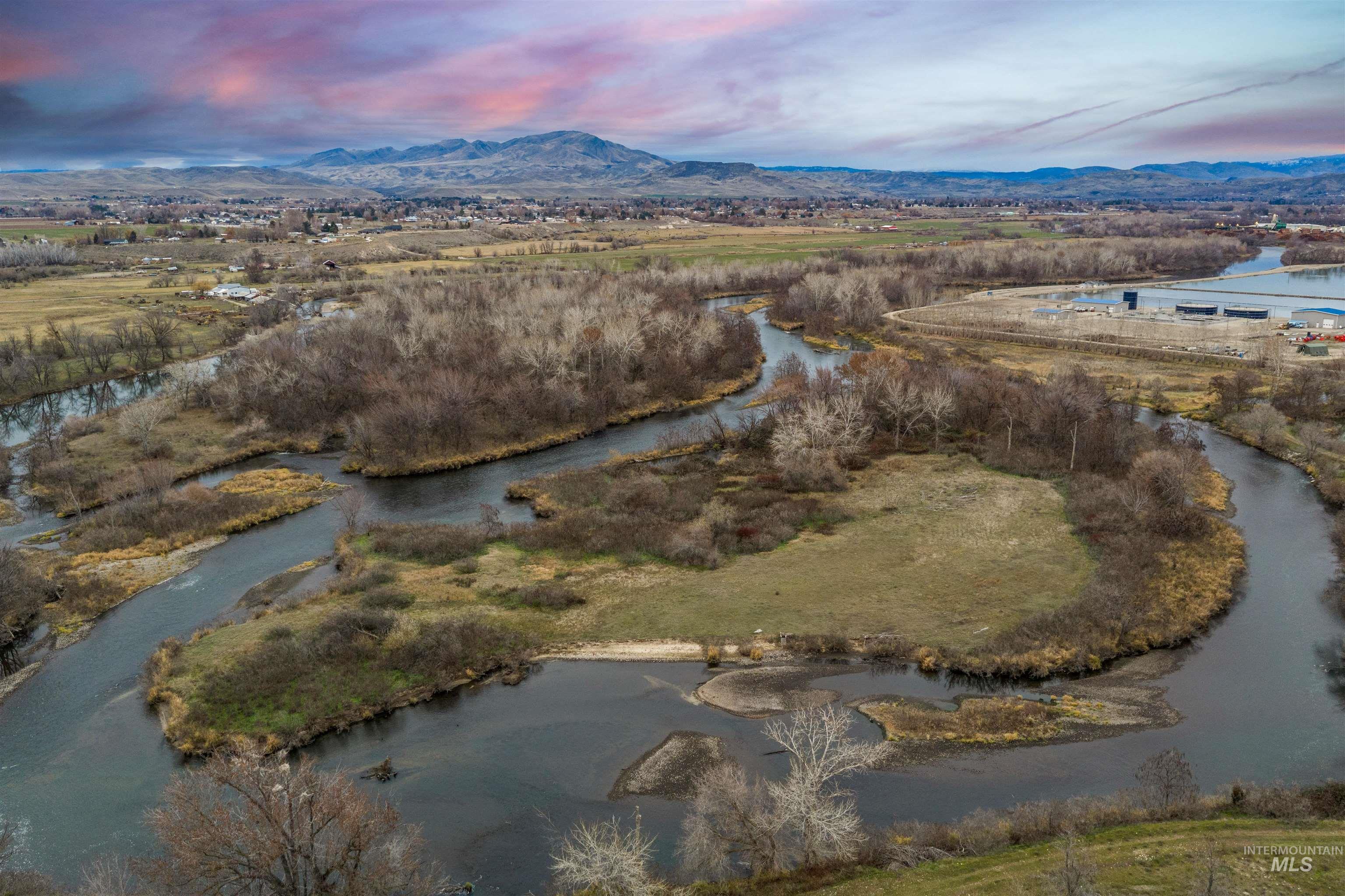 Aerial view at dusk of a water and mountain view