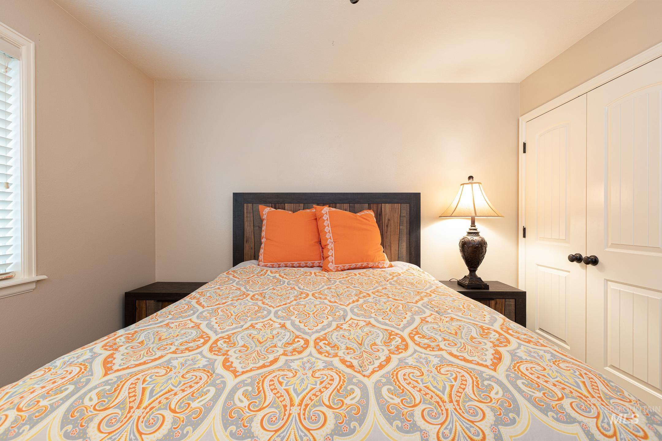 Bedroom with a closet and a ceiling fan