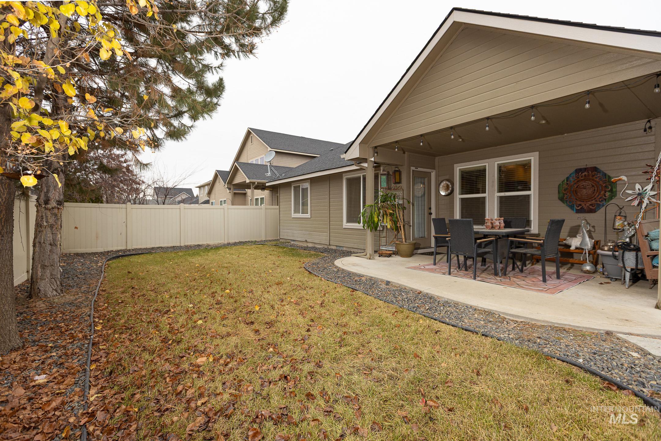 Fenced backyard featuring a patio