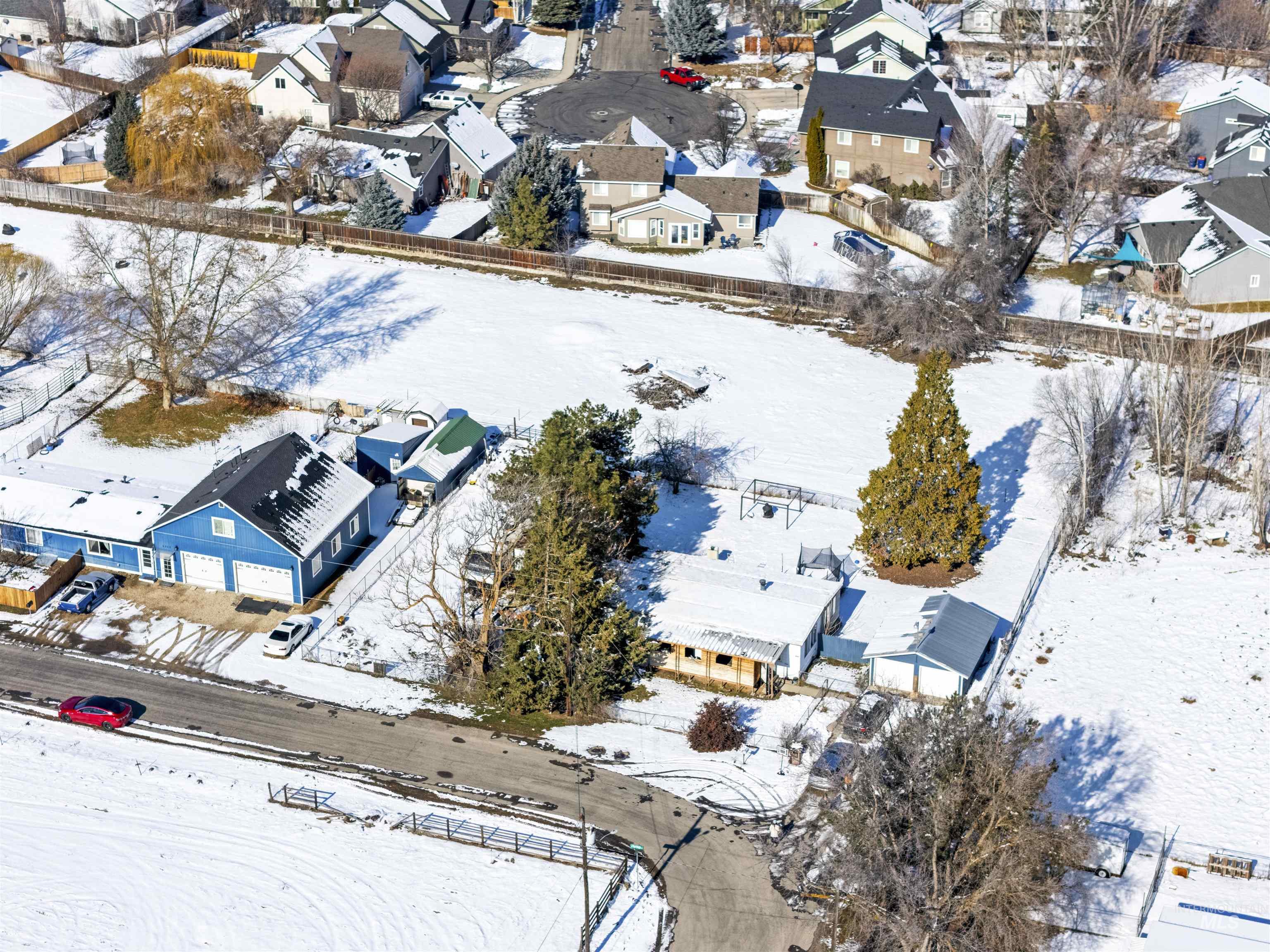 Snowy aerial view featuring a residential view