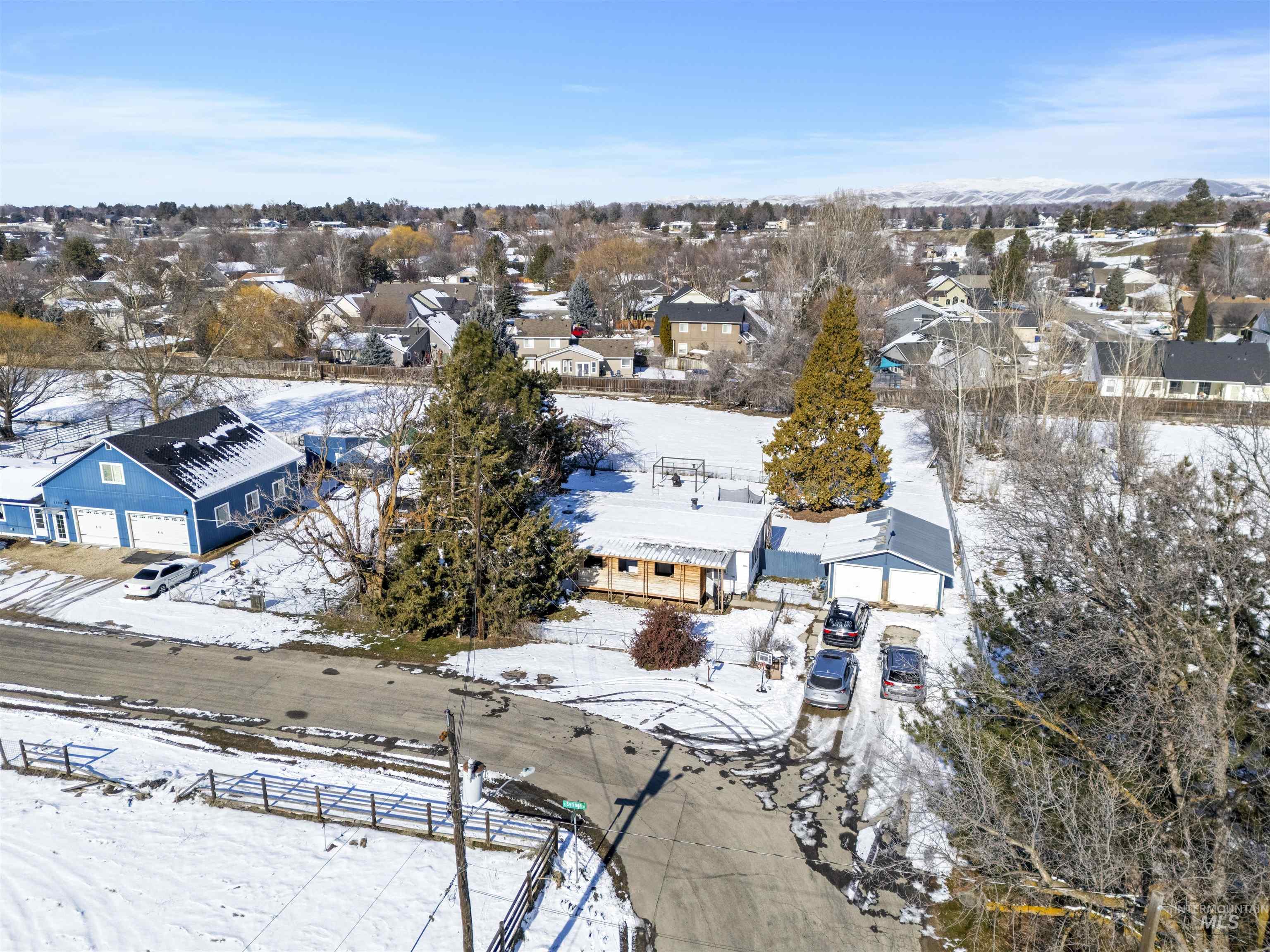 Snowy aerial view with a residential view