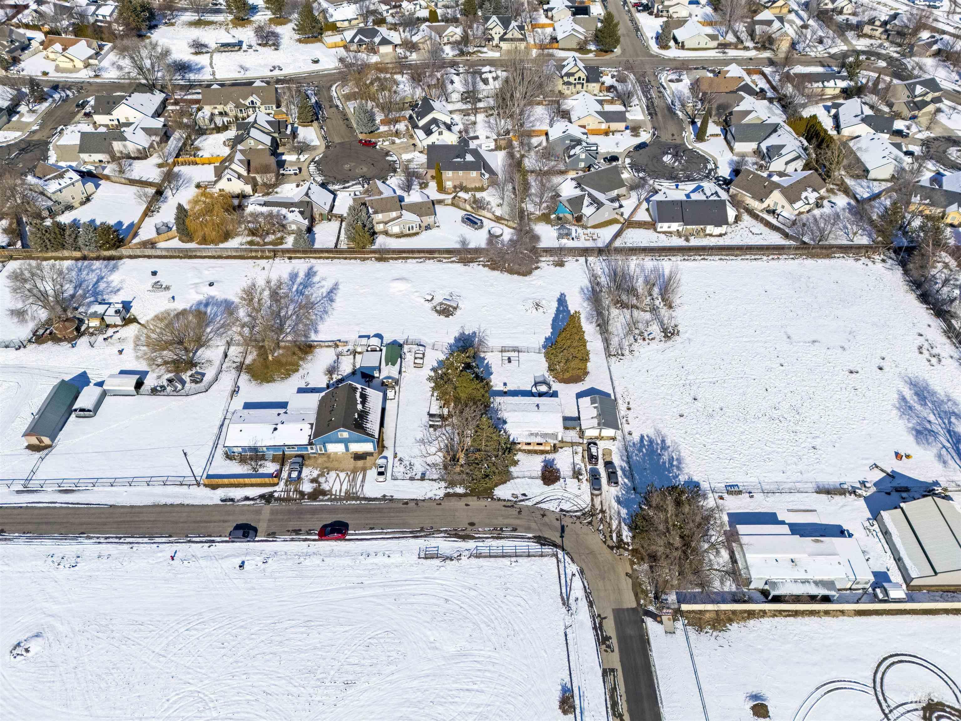 Snowy aerial view with a residential view