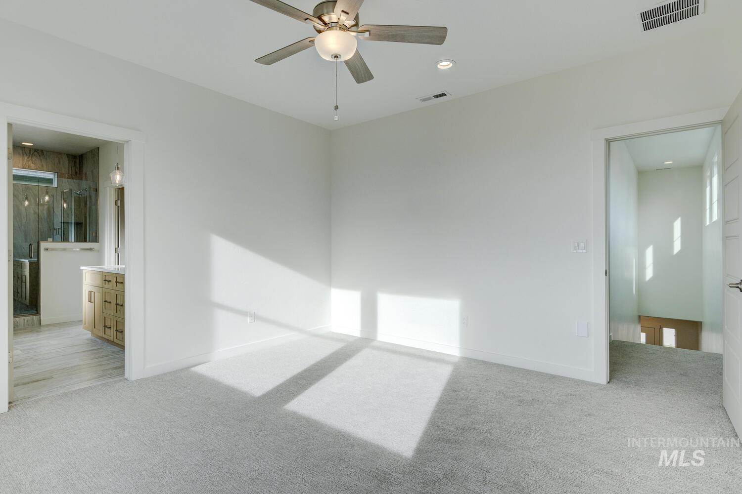 Unfurnished room with light carpet, a ceiling fan, and recessed lighting