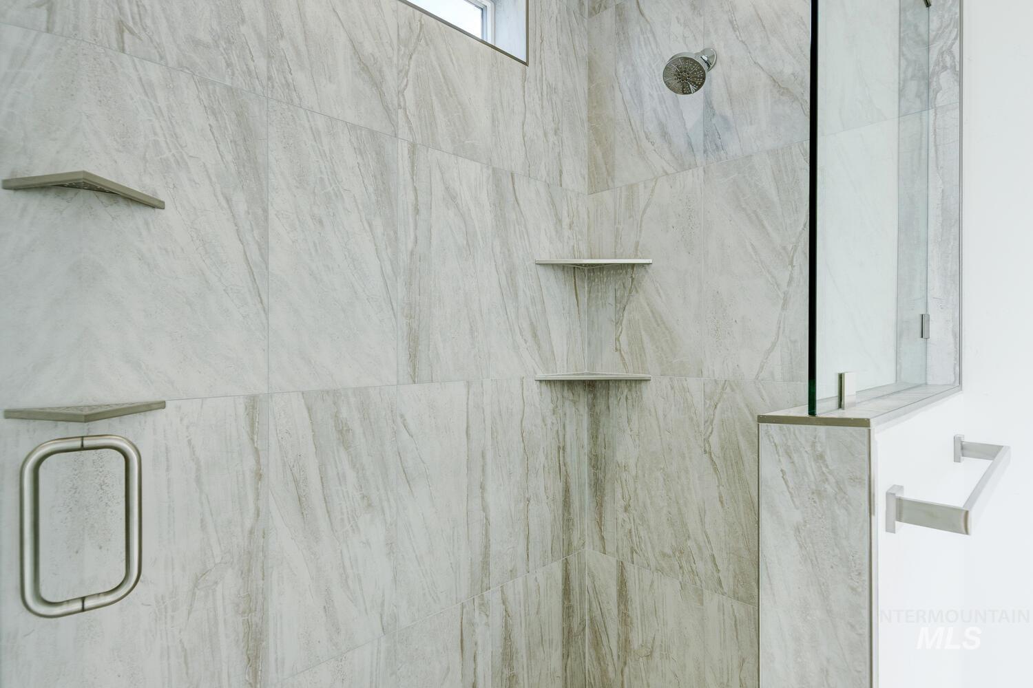Bathroom view of a marble finish shower