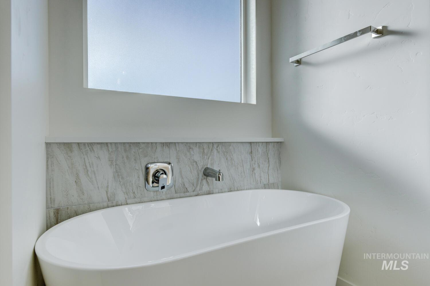 Full bathroom with a freestanding tub