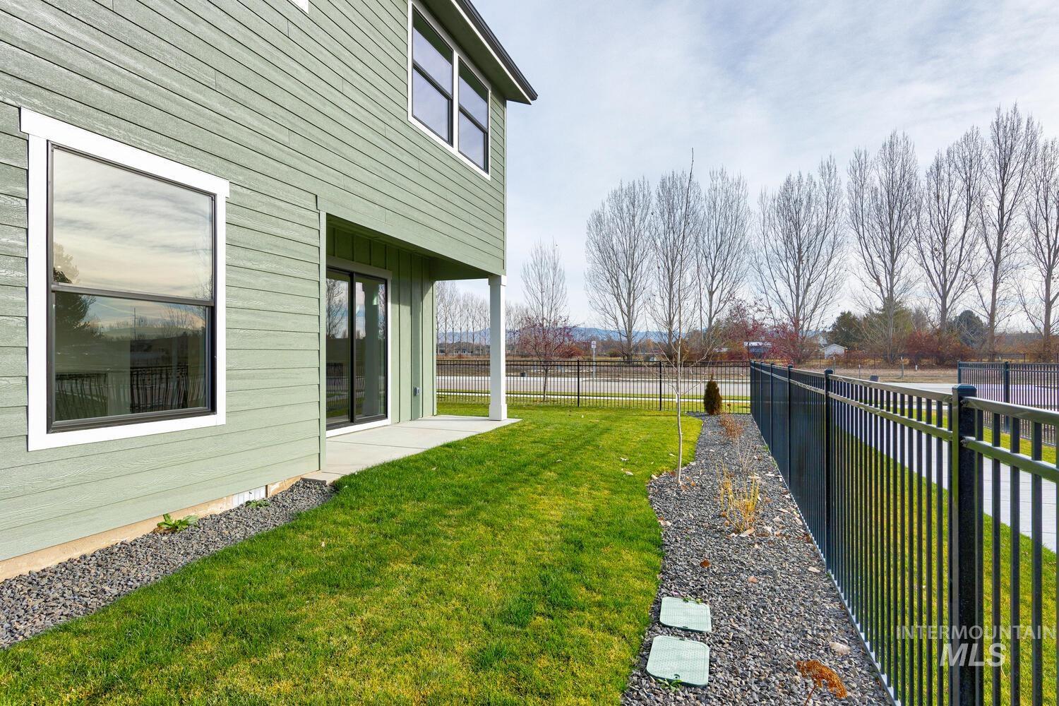 View of fenced backyard