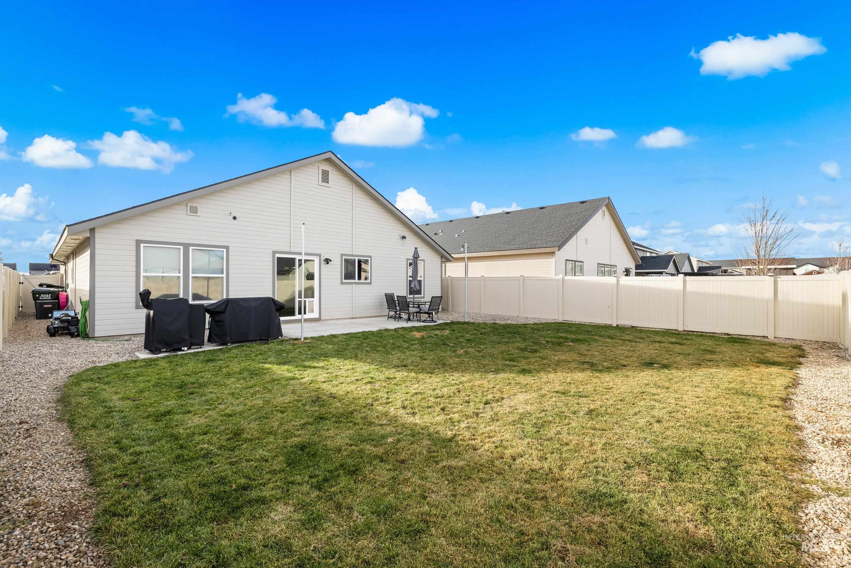Back of house featuring a patio and a fenced backyard
