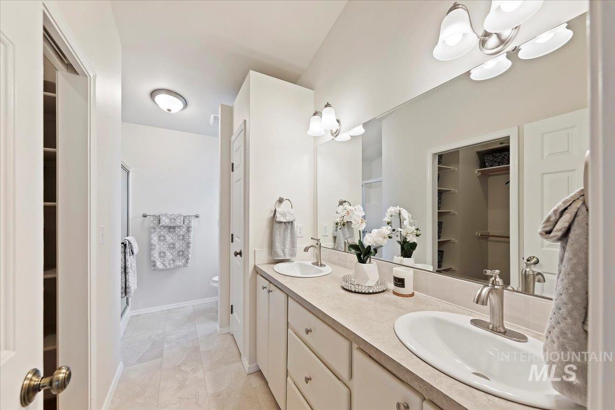 Dual Vanity, Painted Cabinets, New Lighting, New Luxury Vinyl Tile Flooring (LVT)