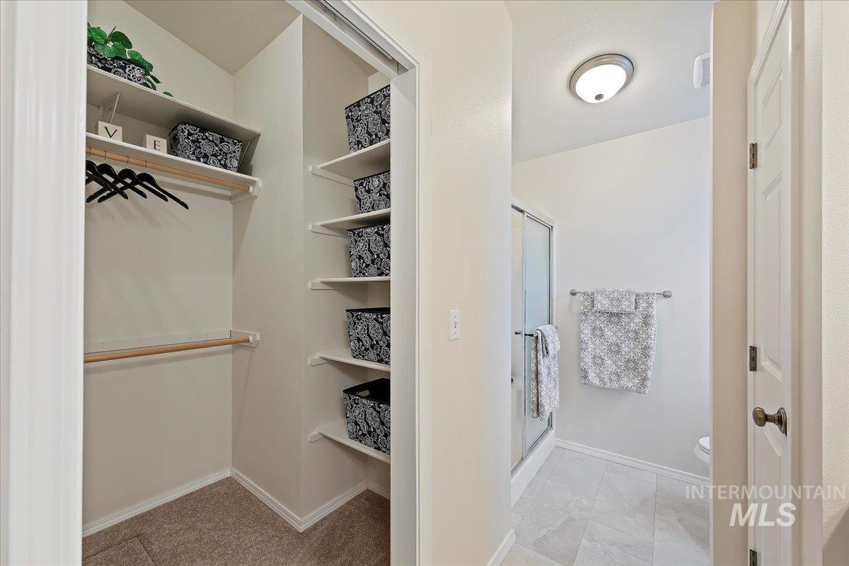 View of spacious closet with Organized Shelves & Hanging!
