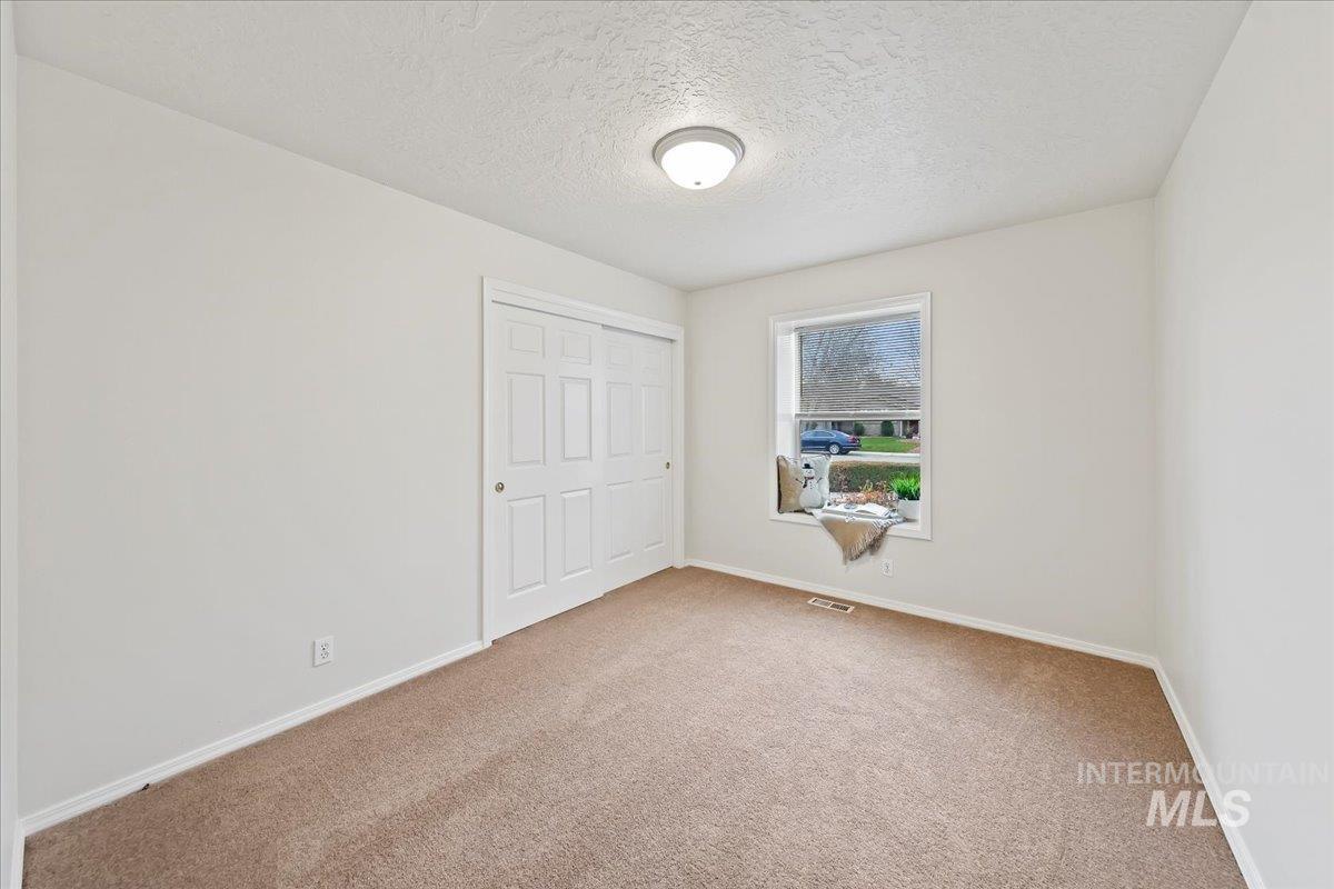 Bedroom #2 is 12x10 with Sunny Window seat area, Brand New Carpet & Pad, New Interior Paint!