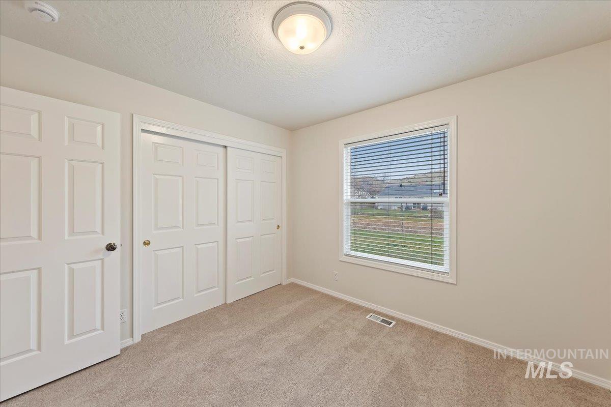 Bedroom #2 has a spacious closet, brand new paint, carpet and pad!