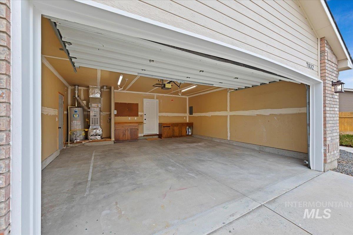 Oversized 2 car garage 21x21 has Storage Cabinets, Workbench, Peg board, New Gas Furnace installed in 2018, 50 Gallon Gas Water Heater New in July of 2024!