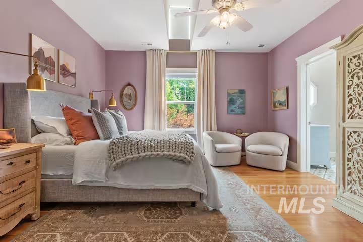 Bedroom featuring wood finished floors and ceiling fan