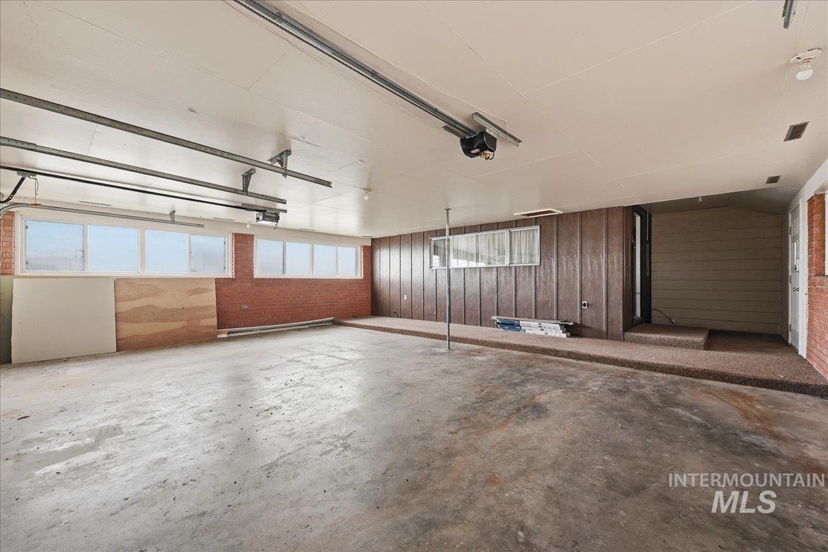 Garage featuring wood walls