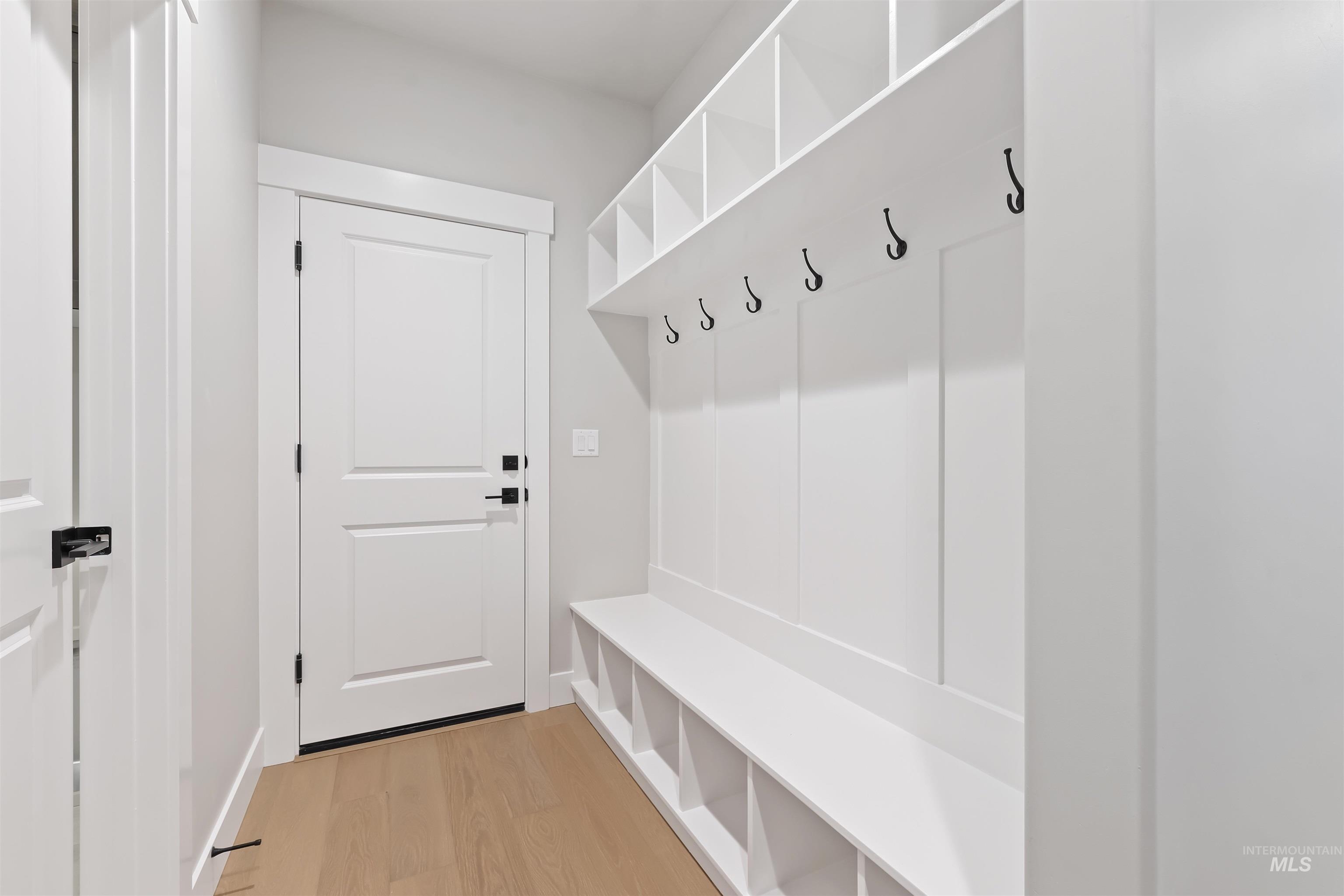 Mudroom featuring light wood-type flooring