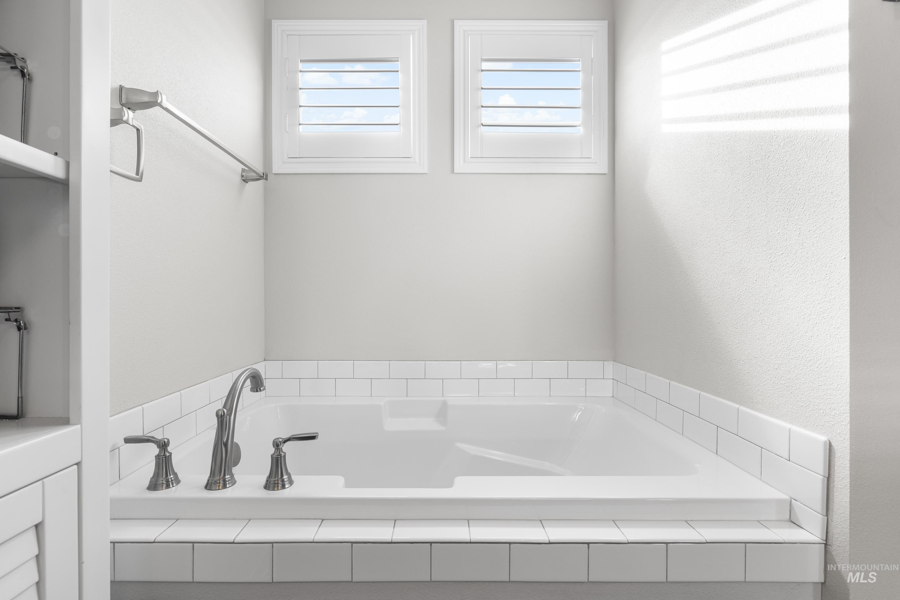 Full bath with a bath