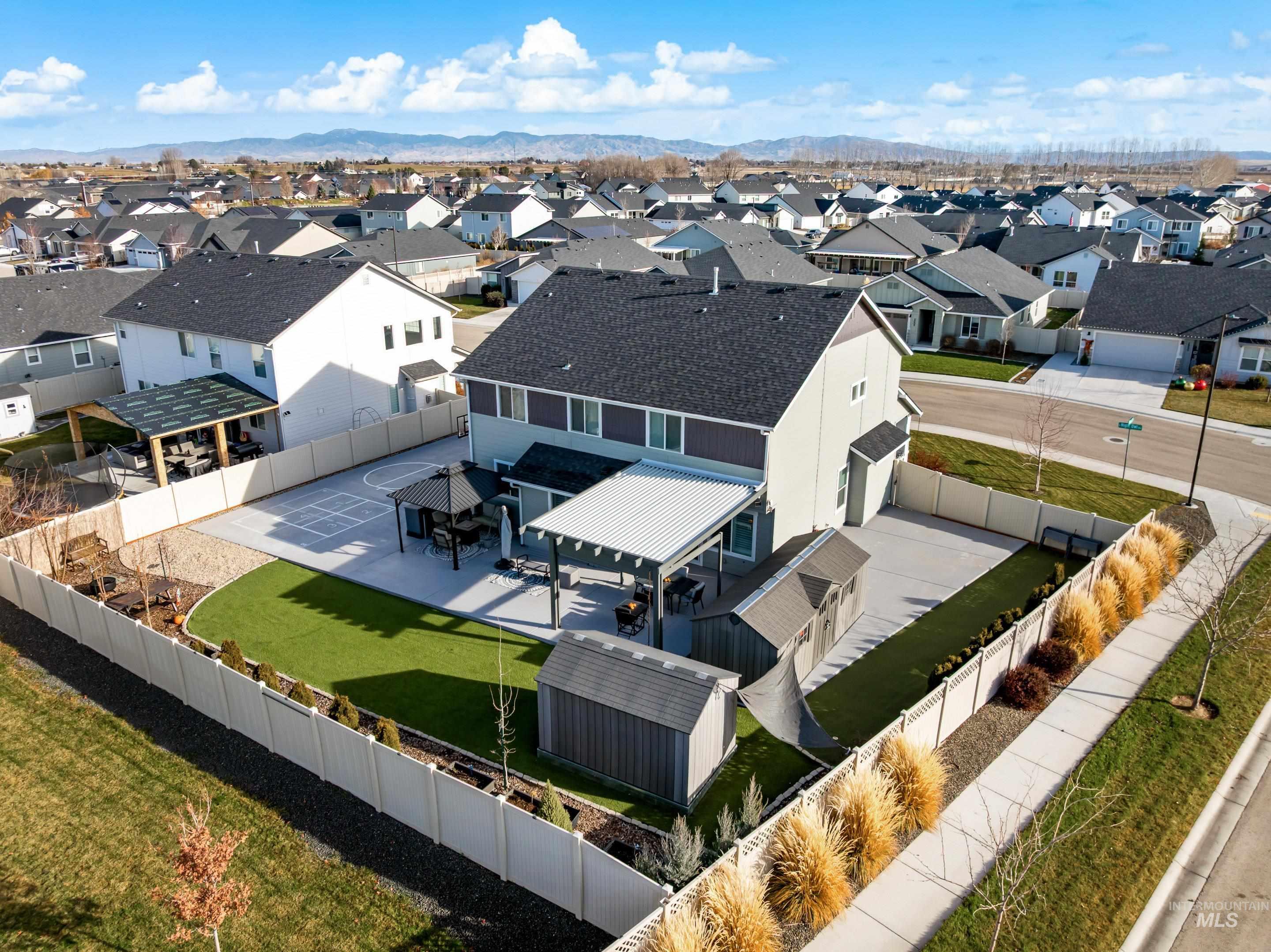 Aerial view of residential area with mountains
