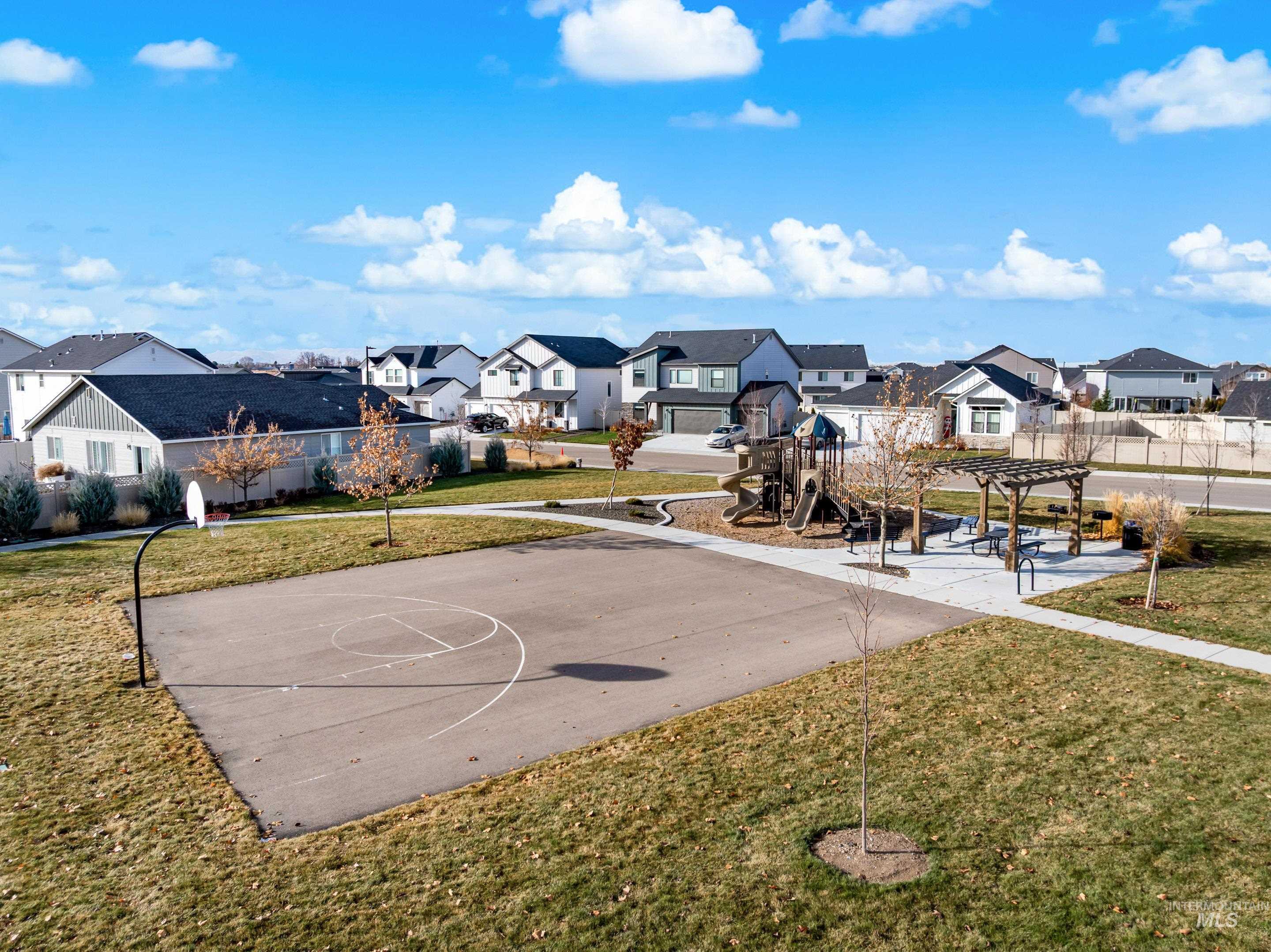 View of sport court featuring a residential view, community basketball court, a patio area, and a pergola