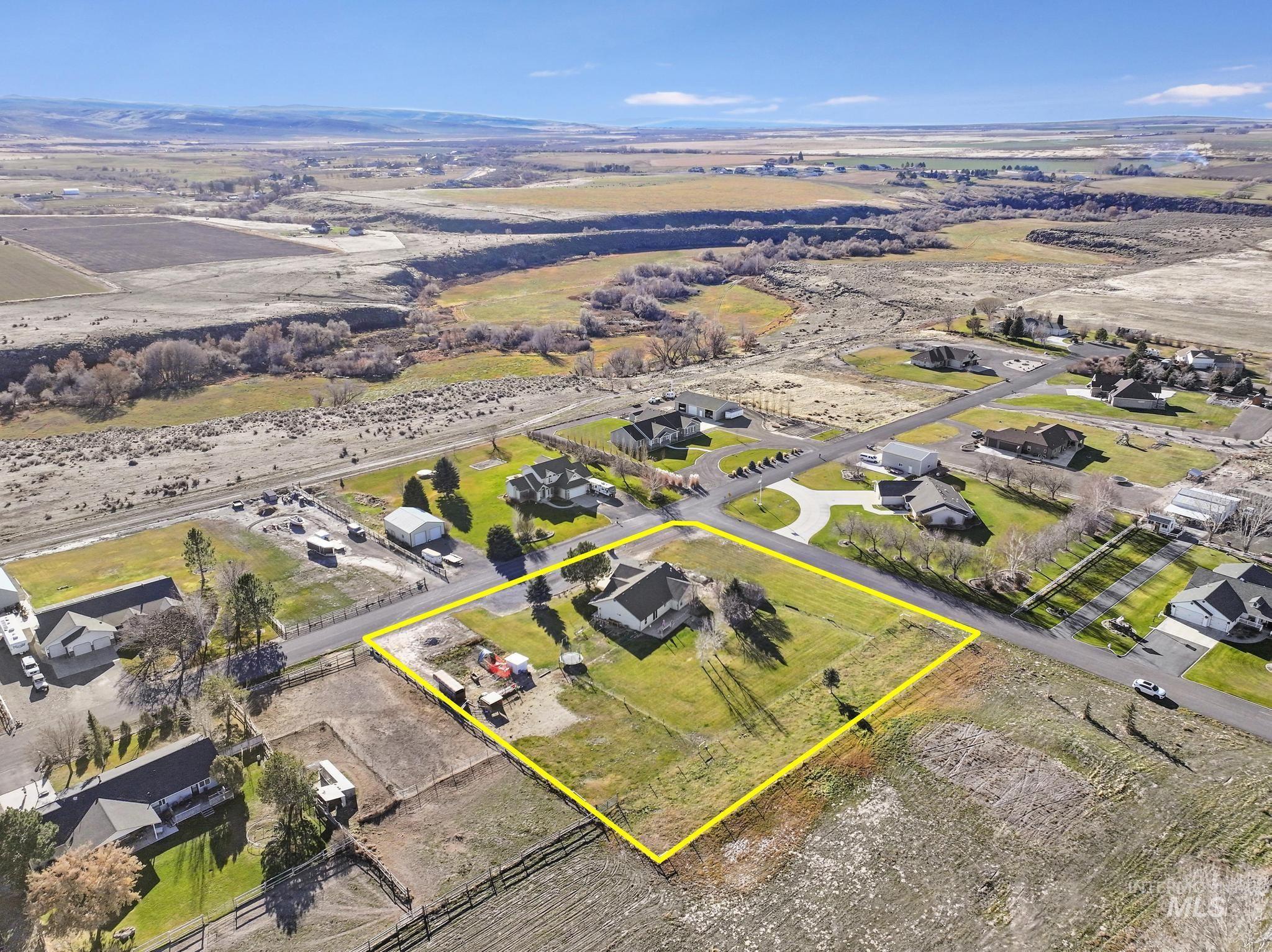 Aerial view of sparsely populated area with property boundaries highlighted