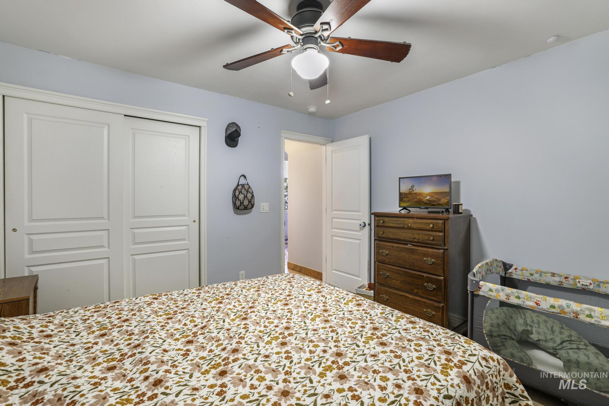 Bedroom featuring a closet and a ceiling fan