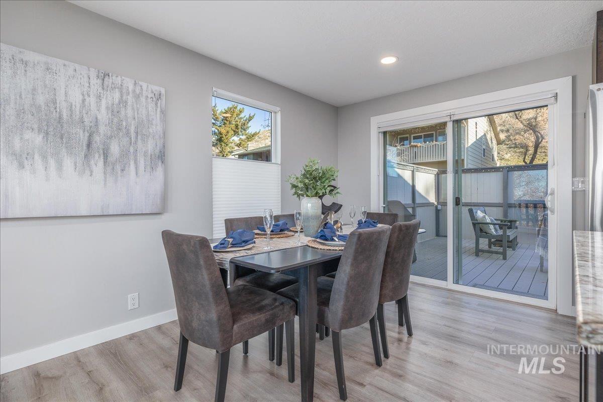 Dining space featuring light wood-style floors and recessed lighting
