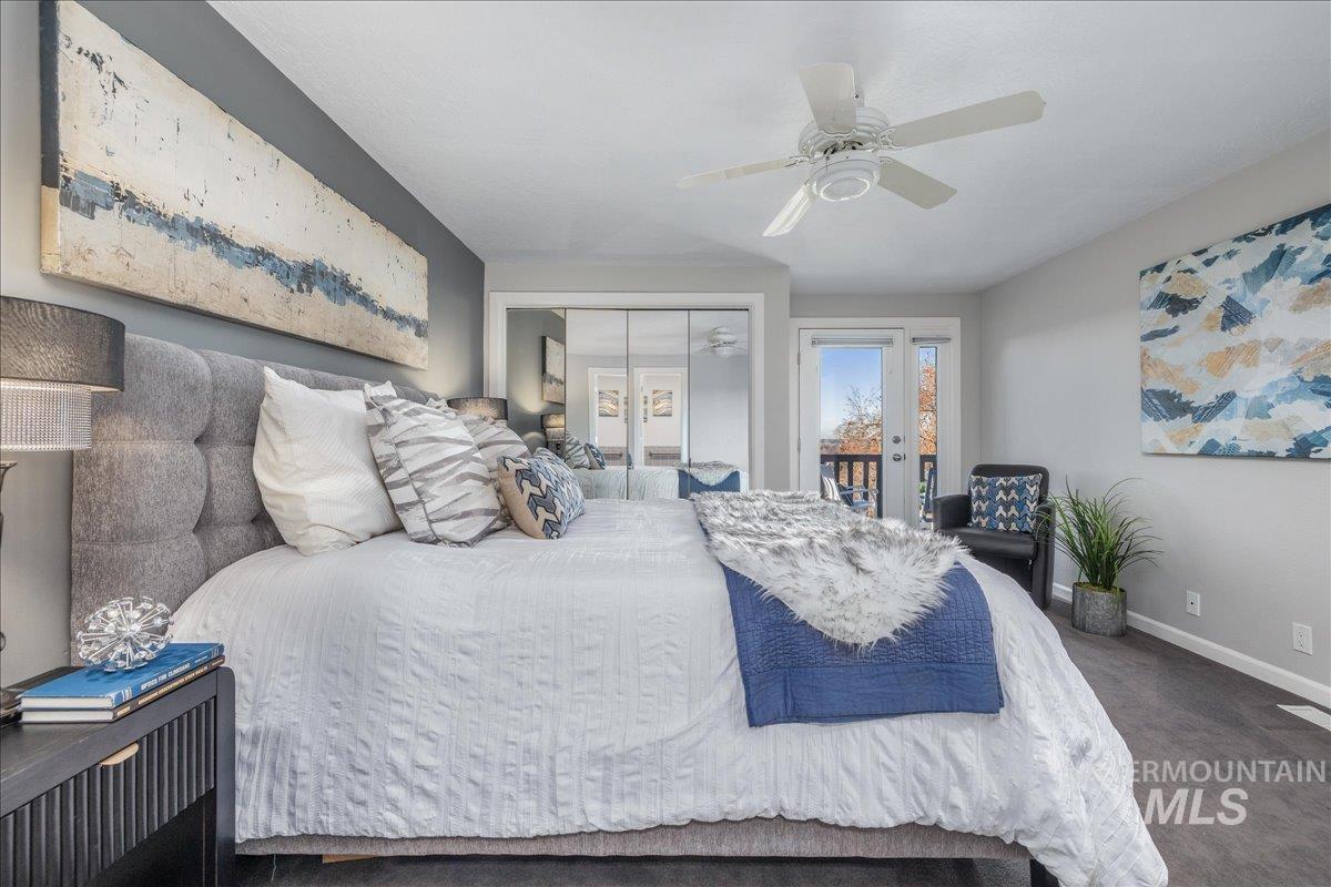 Bedroom with access to exterior, ceiling fan, carpet, and a closet