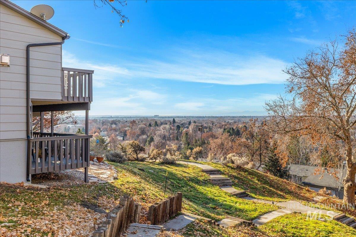 View of yard featuring a balcony