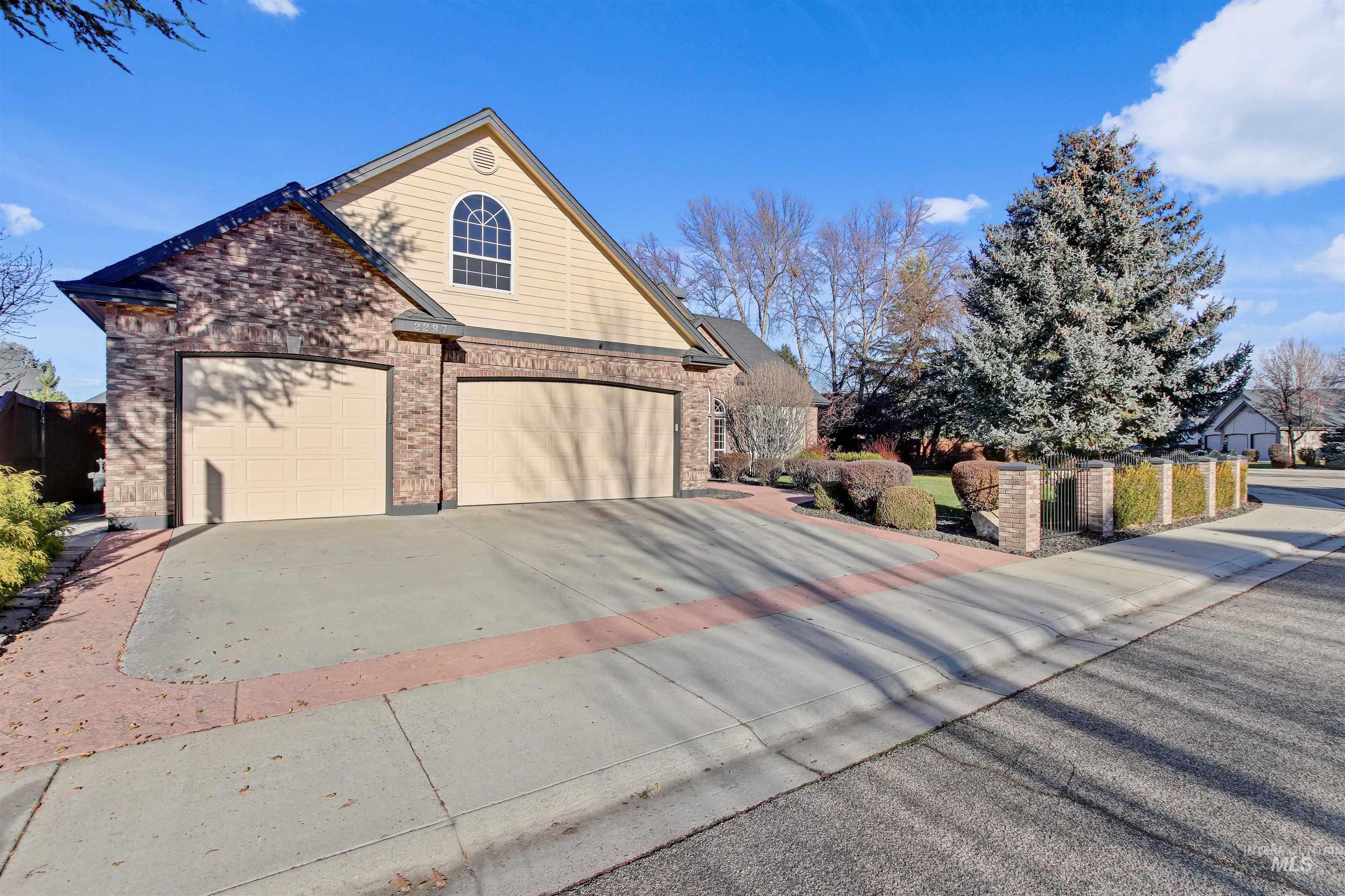 View of side of property with concrete driveway