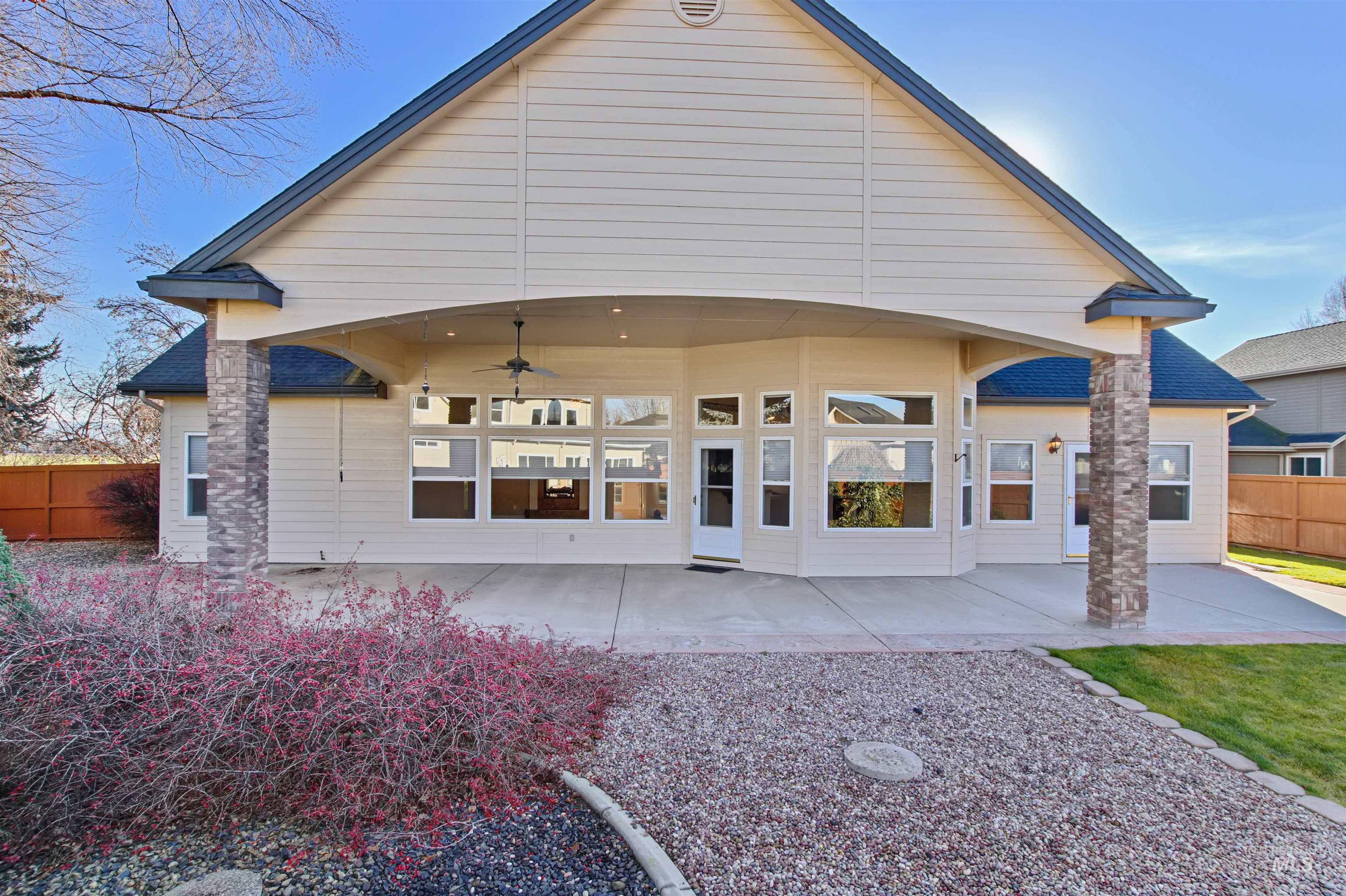 Back of house with a patio and a ceiling fan