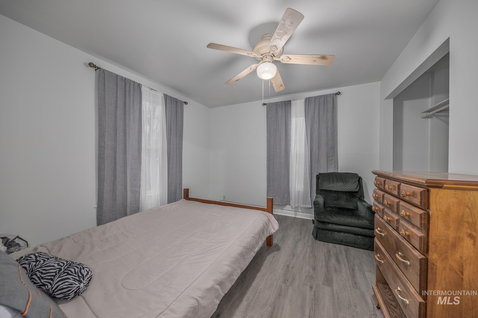 Bedroom featuring light wood-type flooring and ceiling fan