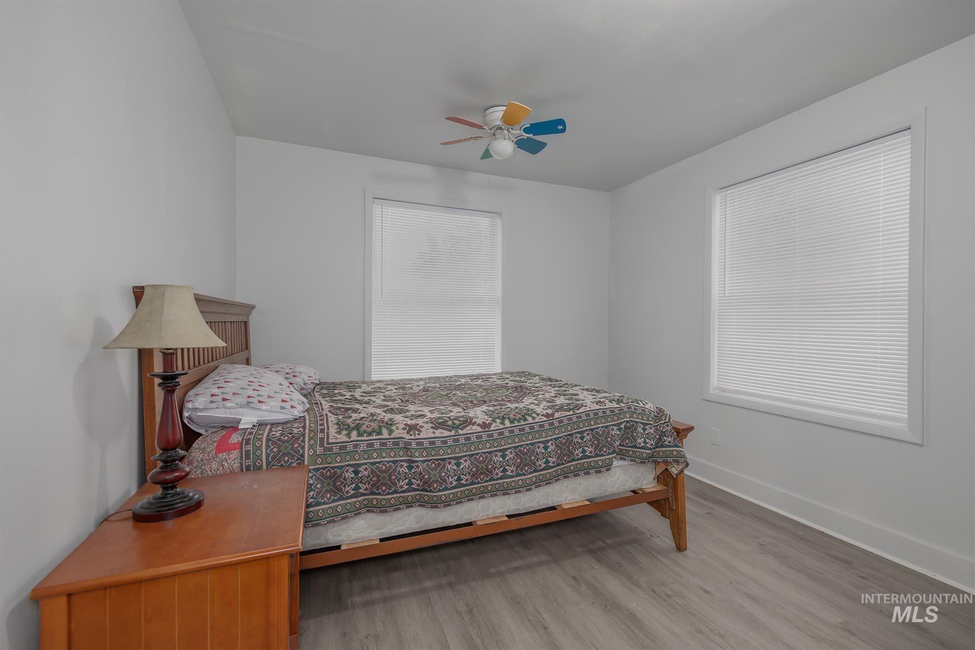 Bedroom featuring a ceiling fan and light wood finished floors