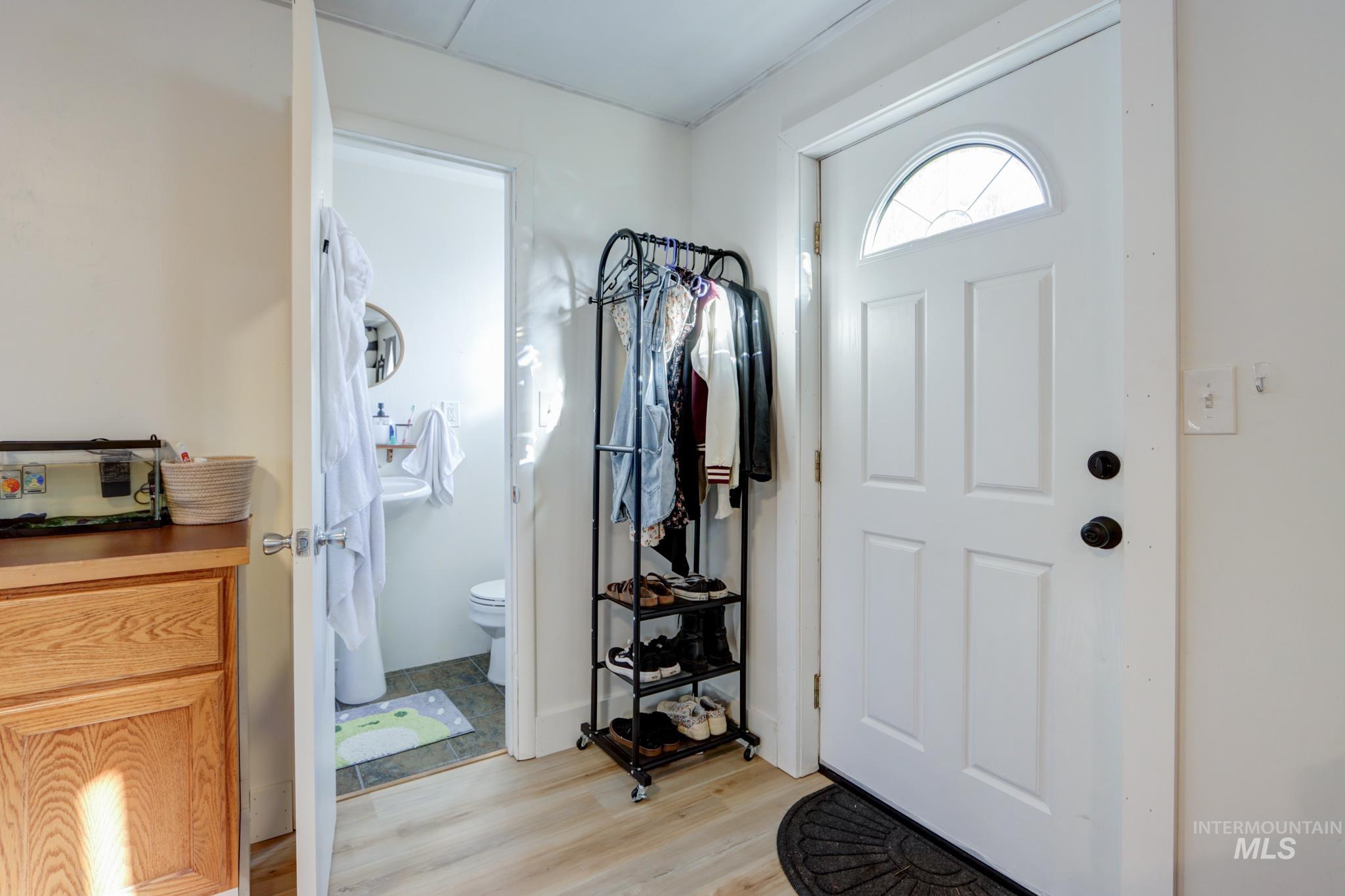 Entrance foyer featuring light wood-type flooring