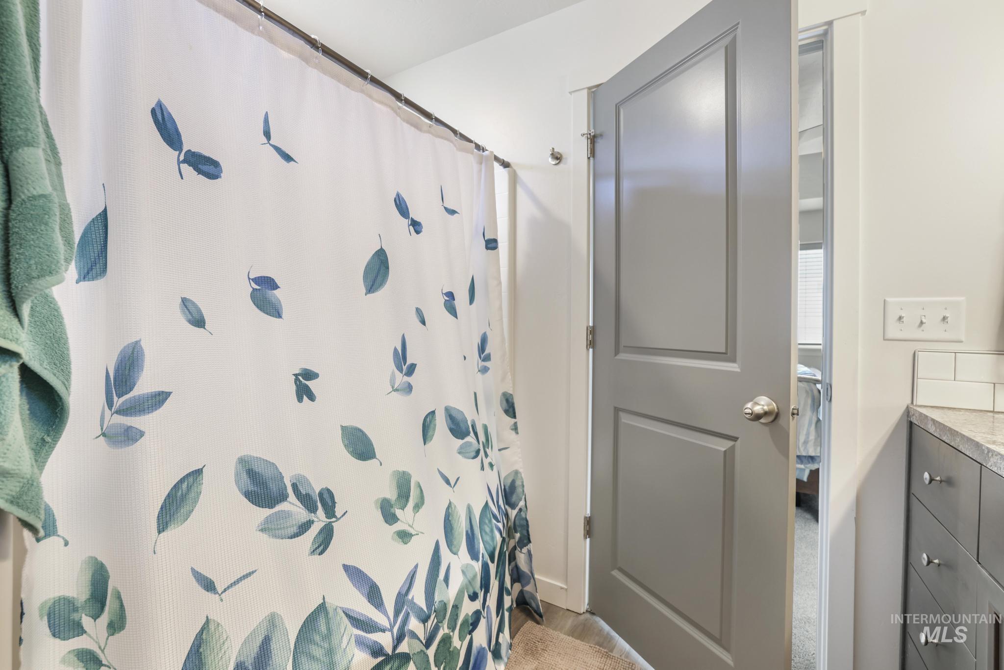 Bathroom with vanity and a shower with curtain