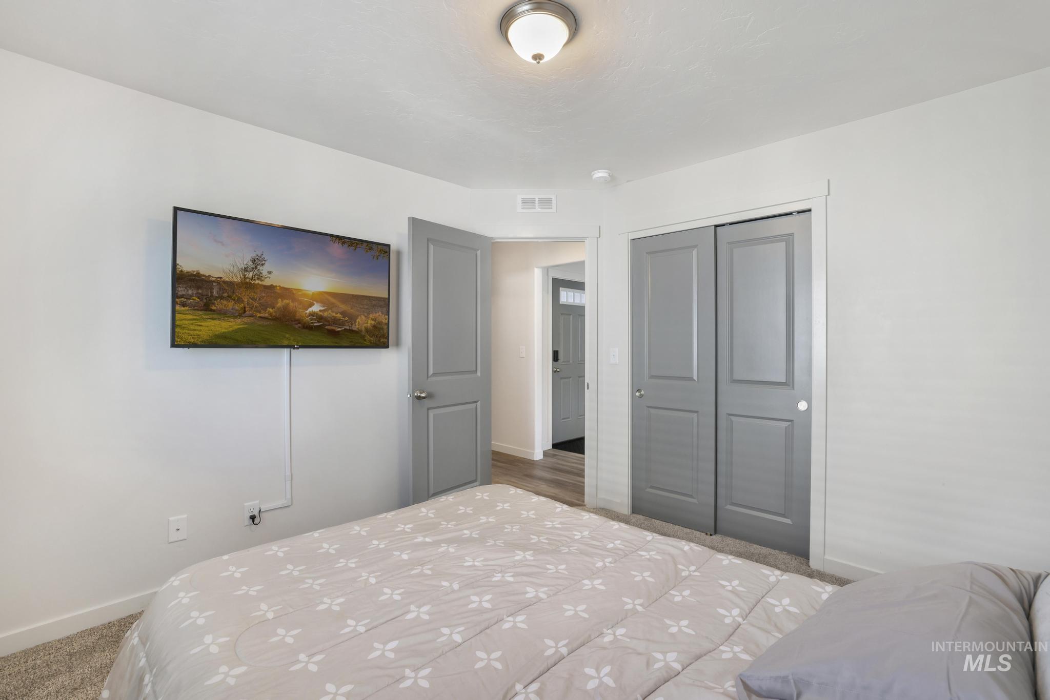 Bedroom featuring a closet and carpet flooring