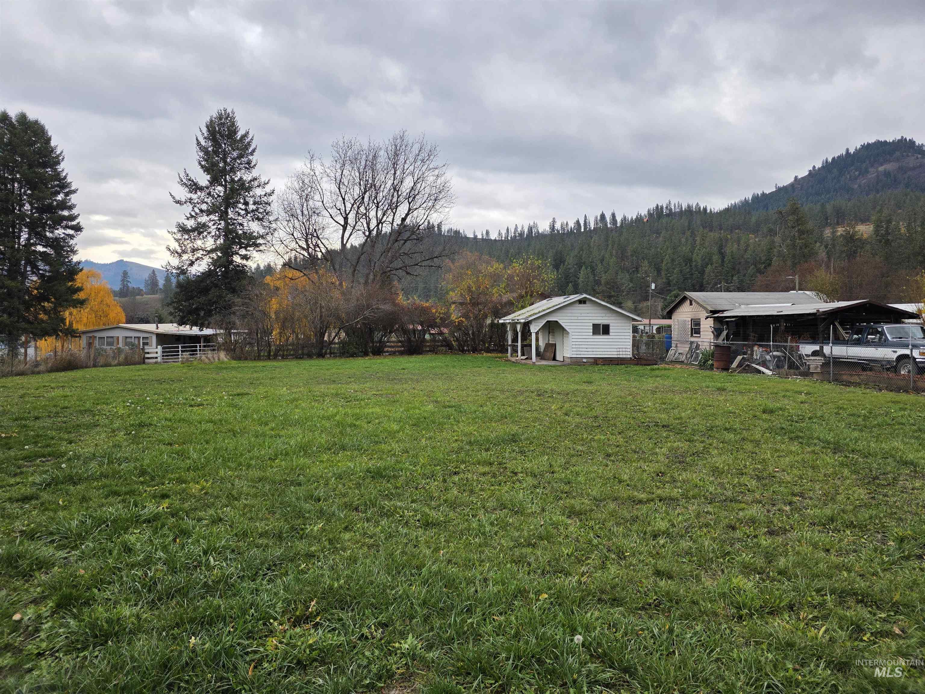 View of yard with a mountain view and a rural view