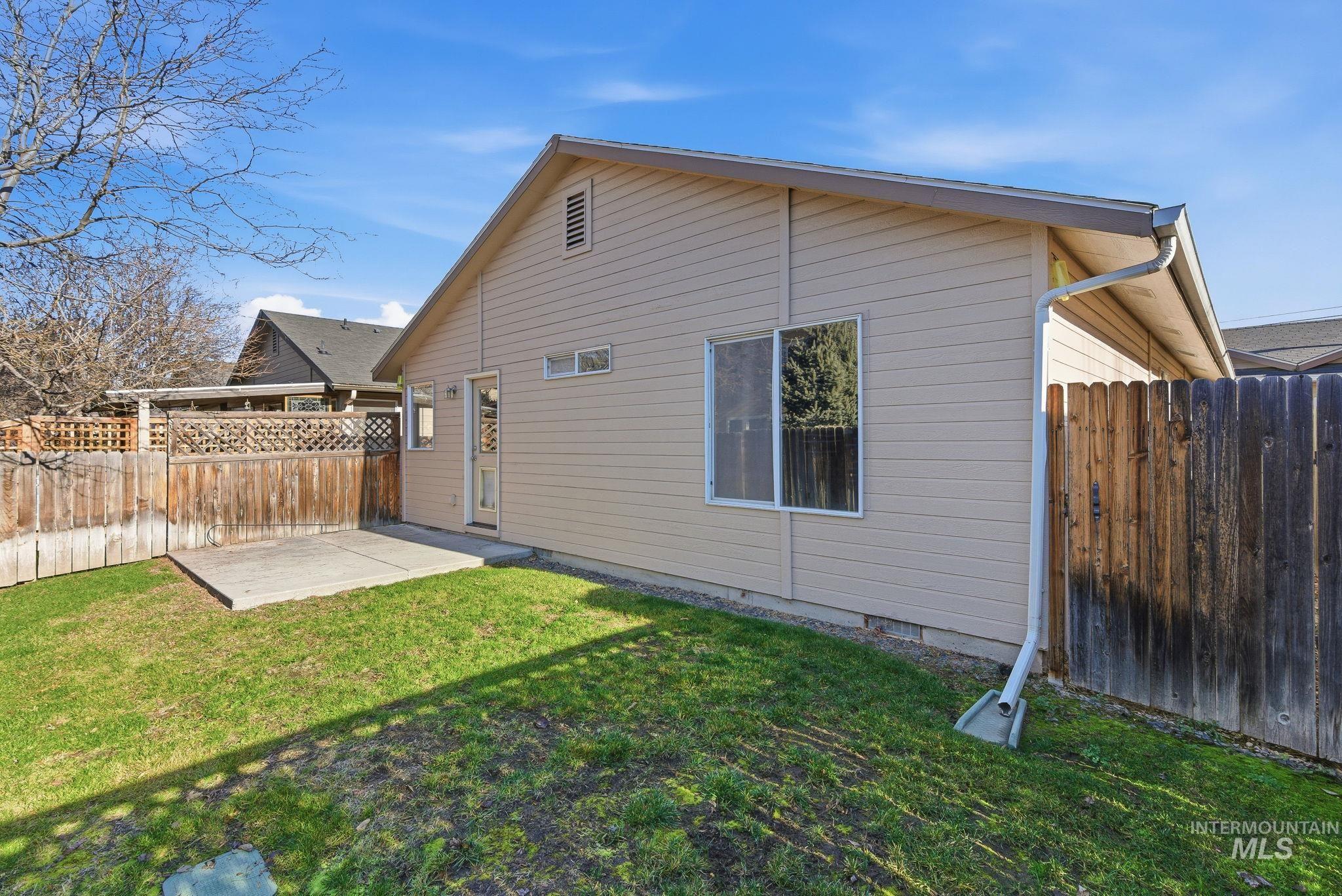 Rear view of house featuring a patio