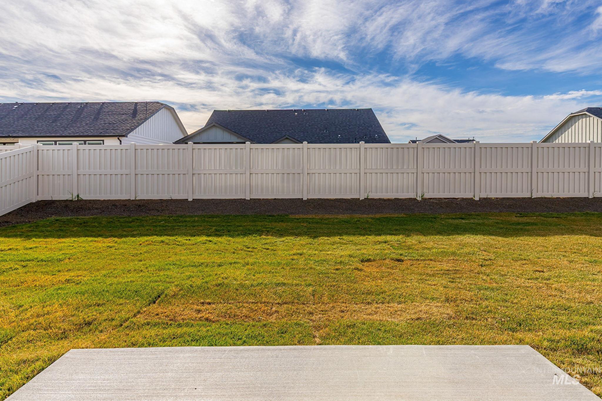 View of fenced backyard