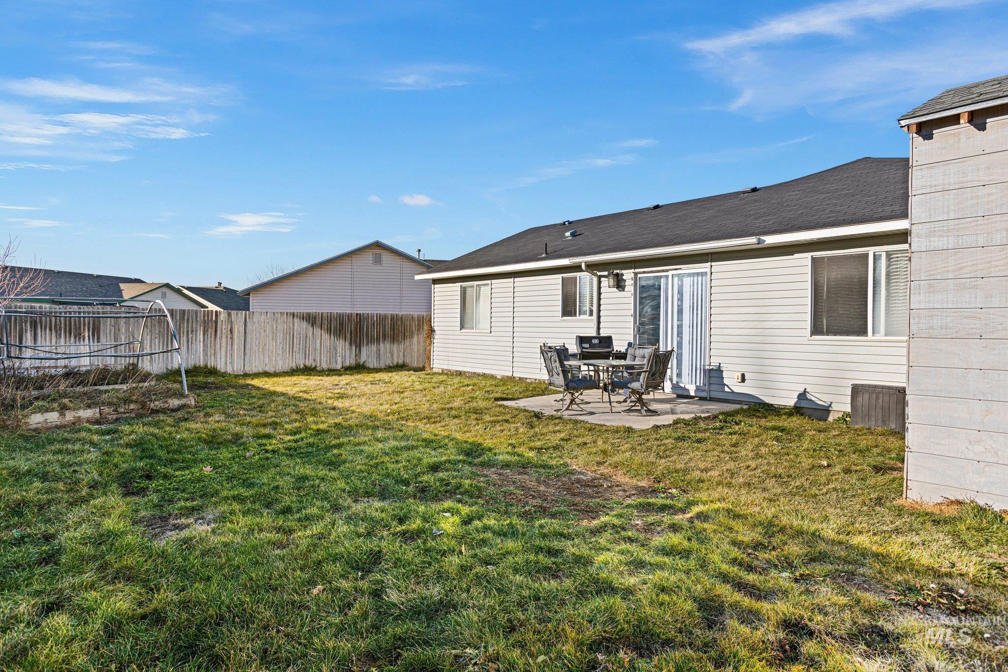 Rear view of property featuring a patio