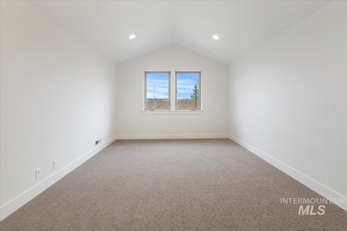 Bonus room featuring light colored carpet, vaulted ceiling, and recessed lighting
