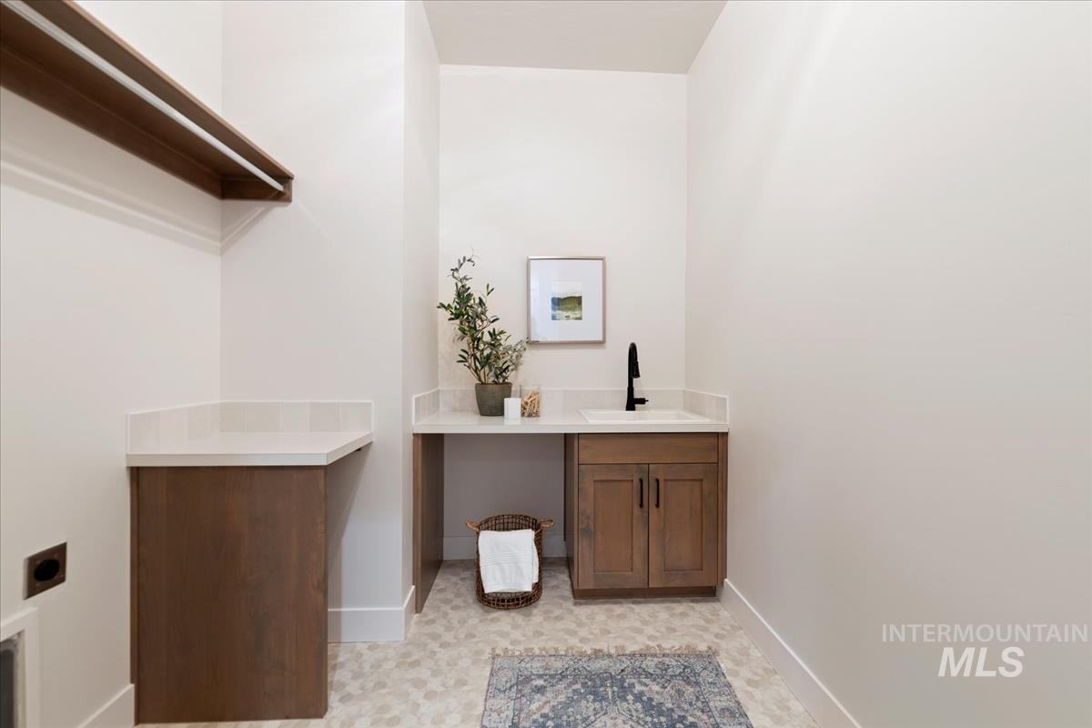 Bathroom with vanity and light floors